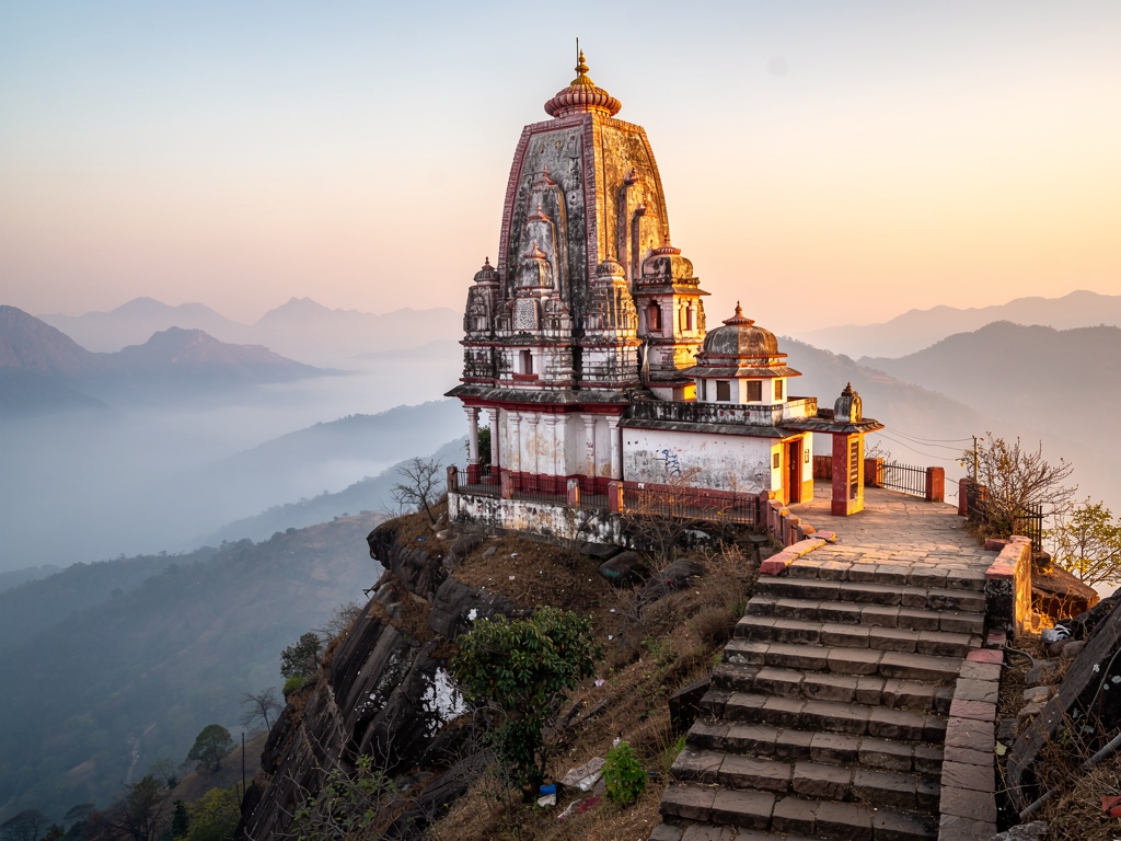 Jyotiba Temple on its hilltop at sunrise with mist in the valleys